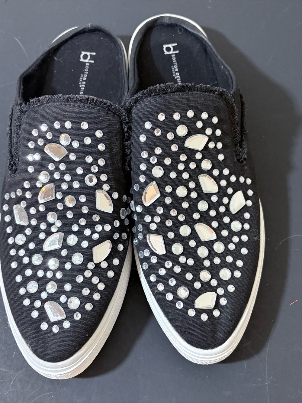 Black Embellished Slip-On Flats by BCBGeneration